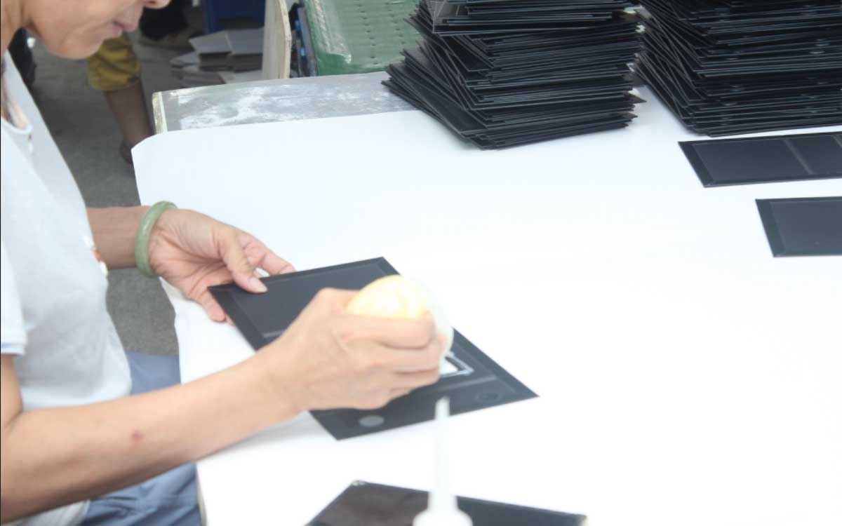 Quality inspector measuring custom paper box